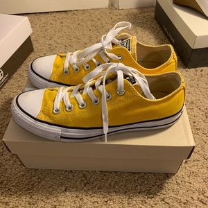 Yellow Converse low tops